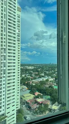 a view of a city with two tall buildings at Cozy Condo Beacon Tower Makati in Manila