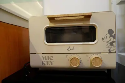 a toaster oven with mickey keys on it at 1BR Mickey Mouse Theme BGC Forbeswood Parklane in Manila