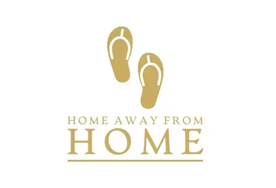 a pair of shoes with home away from home text at Home Away From Home - S Residences in Manila