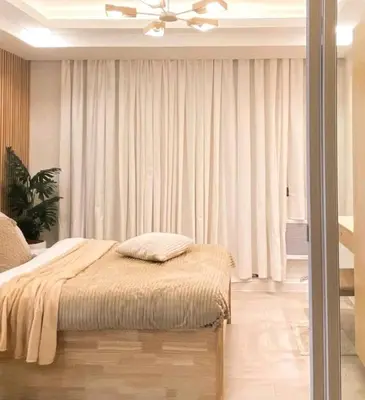 a bedroom with a bed and a ceiling fan at Azure urban resort residences, BAHAMAS tower Japandi model in Manila