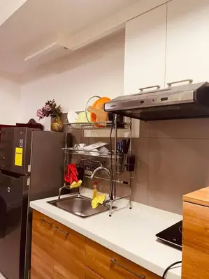 a kitchen with a sink and a refrigerator at Studio 203 T2 Sunshine100 Wifi PoolAccess BunkBed SofaBed in Manila