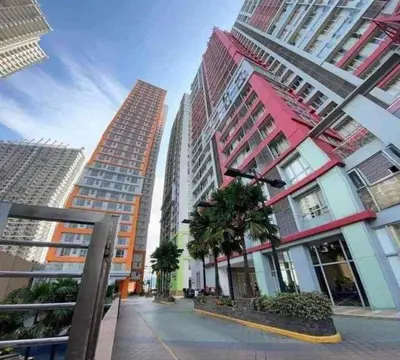 a group of tall buildings in a city at Studio 203 T2 Sunshine100 Wifi PoolAccess BunkBed SofaBed in Manila