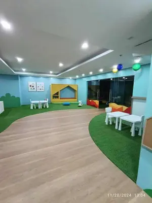 a large room with tables and couches in it at Studio 203 T2 Sunshine100 Wifi PoolAccess BunkBed SofaBed in Manila
