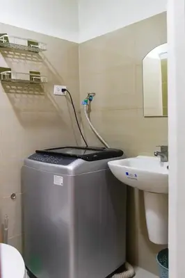 a small bathroom with a sink and a toilet at Straightforward 1 BR Shore 2 Residences near MOA NAIA PICC in Manila