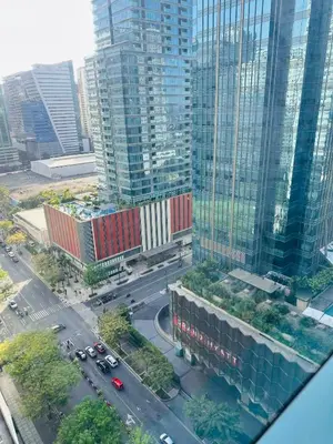 an aerial view of a city with tall buildings at COZI two bedroom family room near Grand Hyatt BGC in Manila