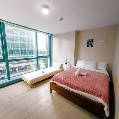 COZI two bedroom family room near Grand Hyatt BGC