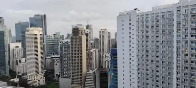 a view of a large city with tall buildings at Aircon Budget Room for 4 persons in Makati in Manila