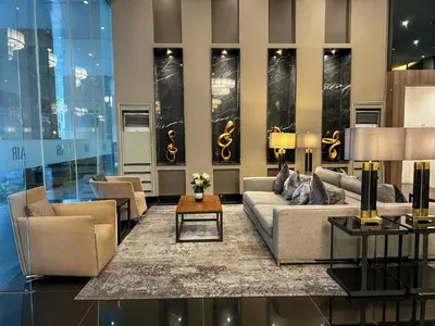 a living room with a couch and chairs and a table at BRAND NEW Casa Airabella with Netflix & Makati City Skyline in Manila