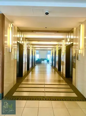 a hallway of a building with a long hallwayngth at CASA SOPHIA Affordable Condo Near Bonifacio Global City BGC CBD in Manila