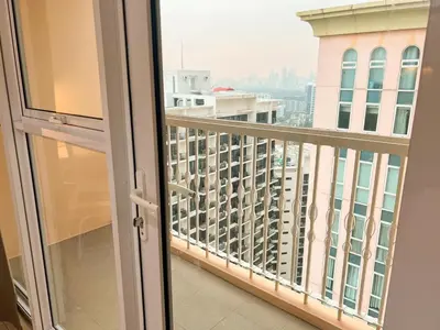 a balcony with a view of a city at Luxurious Condo Beside Venice Mall #vlrtd20e in Manila