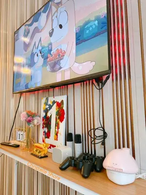 a shelf with a television on a wall at MOA Staycation Haven Cozy 1BR Retreat with Balcony at Shore 3 in Manila