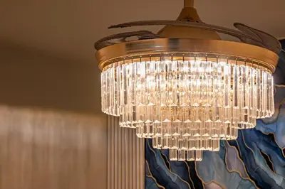 a large chandelier hanging from a ceiling at MOA Staycation Haven Cozy 1BR Retreat with Balcony at Shore 3 in Manila