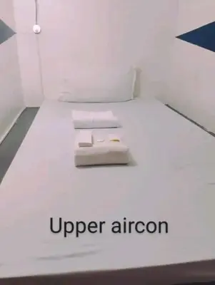 a white bed with the words upper nitrogen on it at RDC - Mariveles Transient Capsule in Manila