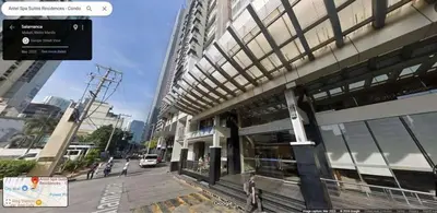 a building on a city street with people standing outside at Studio deluxe cozy staycation Antel Spa Residences in Manila