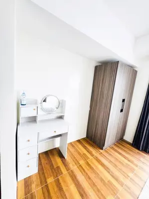a room with a white desk and a door at Luxury Hotel near City of Dreams, Solaire, NAIA, and MOA - City of Bridge in Manila
