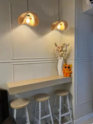 a bar with two stools and two lights at Twin Duckworth Suites T3 in Manila