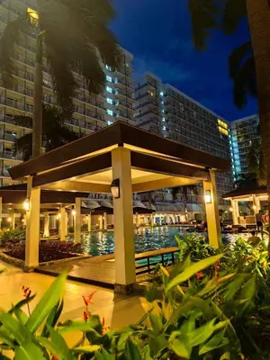 a pavilion in front of a building at night at Mall of Asia 2 Bedrooms in Manila