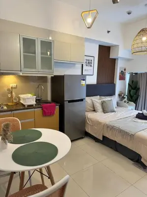 a kitchen with a bed and a table in a room at Studio Unit McKinley Hill Taguig cd21H in Manila