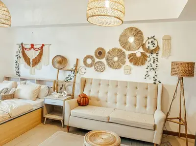 a living room with a couch and decorations on the wall at Venice Luxury Residences Studio McKinley Hill in Manila