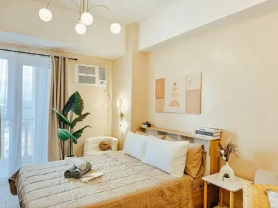 a bedroom with a large bed in a room at Venice Luxury Residences Studio Taguig City in Manila
