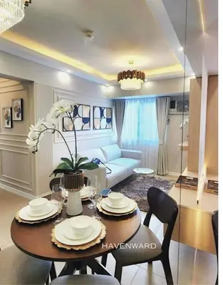 a living room with a table and a couch at Luxe 3BR unit in the heart of BGC Taguig in Manila