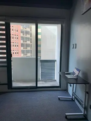 a room with a desk and a large window at 63 sqm Unit for GET TOGETHER at Poblacion, Makati with Private Parking in Manila