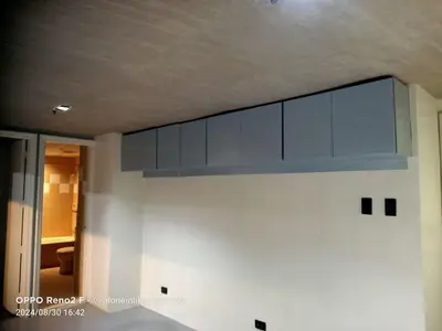 a kitchen with blue cabinets on the wall at 63 sqm Unit for GET TOGETHER at Poblacion, Makati with Private Parking in Manila