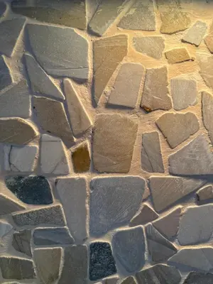 a close up of a stone wall at Evergreen suite- 1 bed 1 sofa bed, light sync TV in Manila