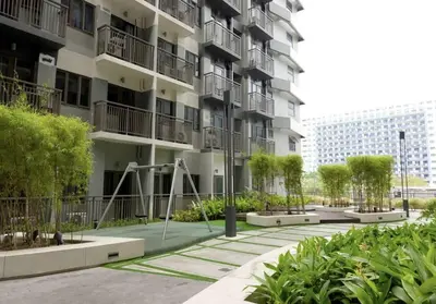 an apartment building with a playground in front of it at S Residences Two Beds Room Near MOA Pasay Manila in Manila