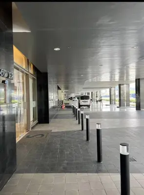 a hallway of a building with a row of poles at S Residences Two Beds Room Near MOA Pasay Manila in Manila