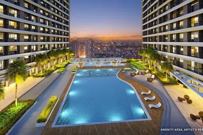 an aerial view of a building with a swimming pool at 1BR Condotel with Balcony at FAME Residences #FM56 in Manila