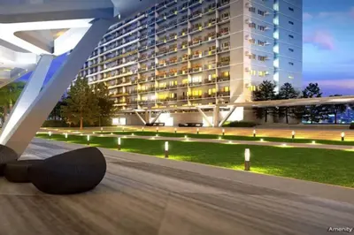 a skateboard laying on the ground in front of a building at 1BR Condotel with Balcony at FAME Residences #FM57 in Manila