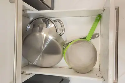 two utensils and a tea pot and a strainer at Alpha Grandview Malate Condo 2004 in Manila