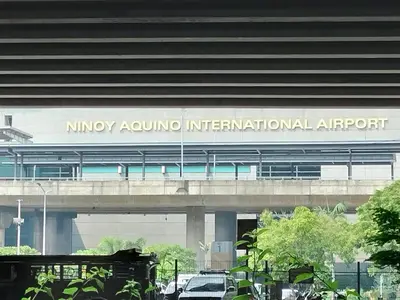 a building with a sign that reads nirvana aquarium international airport at The Nest C5-7F EightyOne Newport Boulevard Condominium, Pasay City in Manila