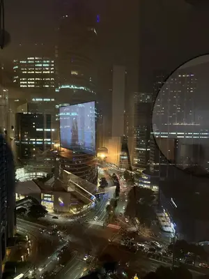 a view of a city at night with traffic at Air Residence- Makati in Manila