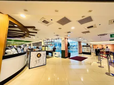 a lobby of a store with people in it at Budget Accommodation at Ace Suites by the Famous Indoor Water Spa in Manila
