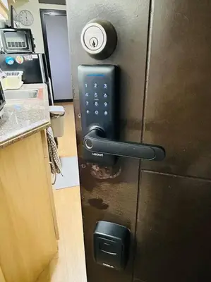 a refrigerator with a remote control on it in a kitchen at 1BR Calathea Place nr Airport, Netflix,50mbps Wifi in Manila