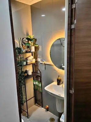 a small bathroom with a sink and a mirror at 1Br FREE parking with balcony near RCBC, Trident, MMC in Manila