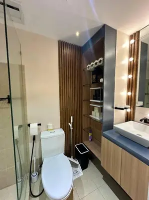 a bathroom with a toilet and a sink at Cozy Unit Right by the Pool with Massage in Silang