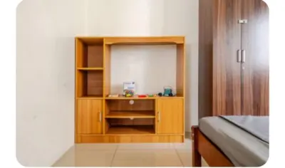 a bedroom with a wooden book shelf and a bed at Sosyal Staycation , Pasay City Shore Residences Tower D Sunrise Drive Mall of Asia Complex Pasay City Philippines SMDC SHORE 1 RESIDENCES Pasay City in Manila