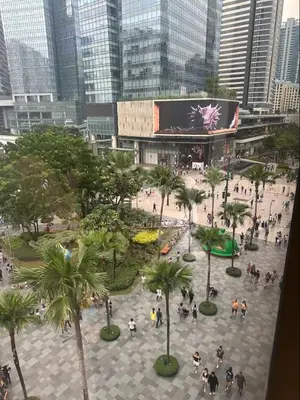 a group of people walking around a plaza in a city at King Bed, Washer, Air Dry, Sauna, Gym & Pool Access, FAST Wi-Fi, Elegant Studio, Near Venice Grand Canal Mall, Walking Distance Britsh Embassy, 5 min drive to BGC, 10 min drive to Manila Airport NAIA 3 in Manila