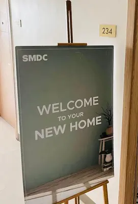 a sign that says welcome to your new home at SMDC Bloom residence Sucat Stunning 2BR in Manila