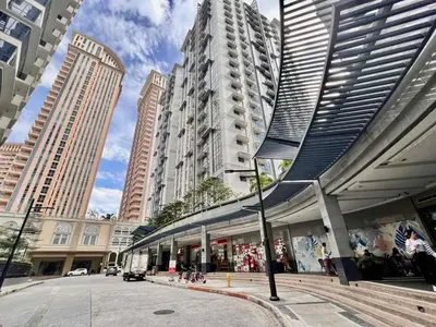 a view of a city with tall buildings at Cozy Home in BGC in Manila