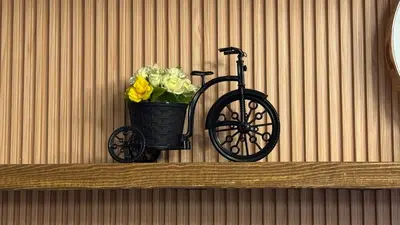 a black bike with yellow flowers on a shelf at 2BR Unit in SMDC Shore 3 with pool access in Manila
