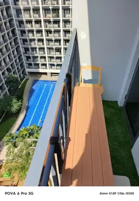 a balcony with a swimming pool on a building at Mitch serene shore in Manila