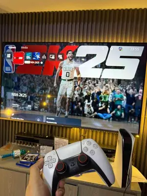 a person holding a video game controller in front of a television at Oveecation Suites Positano Smarthome in Manila