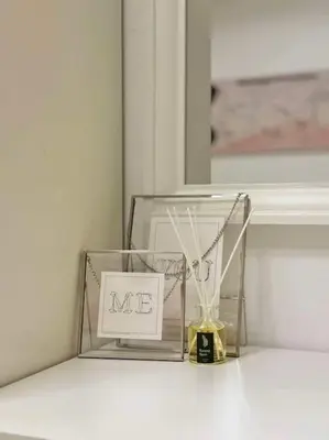 a glass box with a sign that says me at Taguig - Modern Luxe at Grace Residences in Manila