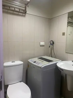 a bathroom with a toilet and a sink at P3K Shell Staycation in Manila
