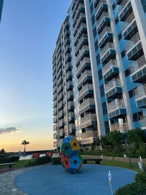 a sculpture in front of a large apartment building at Luxury 1BR beside Okada Manila in Manila