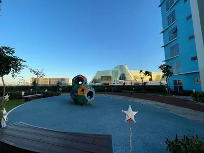 a playground with a star and a building in the background at Luxury 1BR beside Okada Manila in Manila
